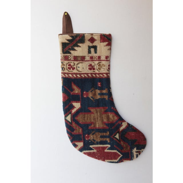 Celebrate the season with this one-of a kind Christmas stocking, handcrafted from a genuine antique tribal rug. Rich in...