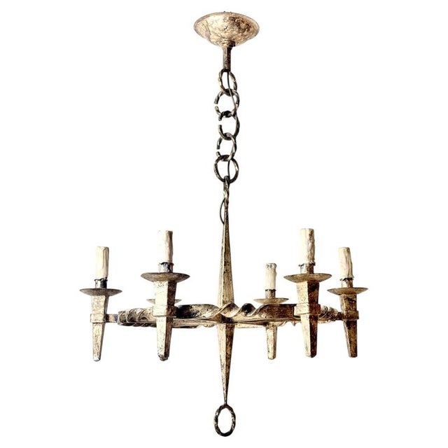This exceptional six-light wrought iron chandelier is an authentic architectural lighting piece originating from a private...