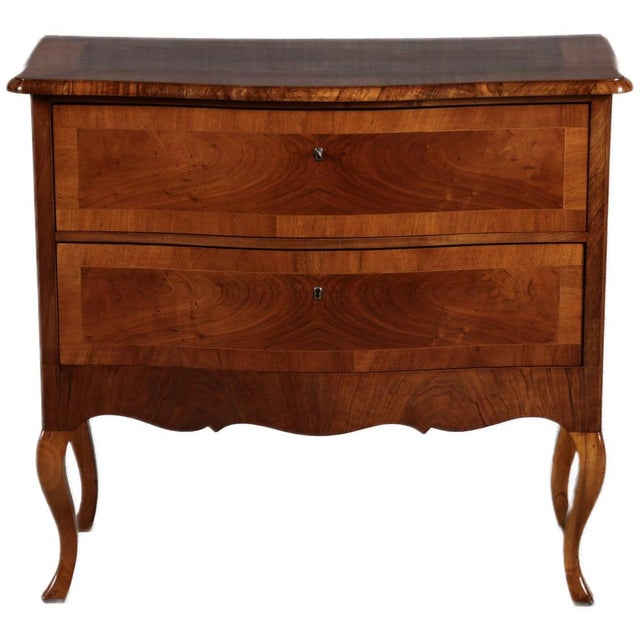 Age and Origin: The chest of drawers is likely from the period between 1900 and 1920, and its provenance is uncertain....