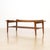 This elegant mid-century coffee table combines sculptural design with practical functionality. Crafted in beautifully...