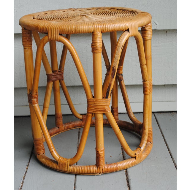 This small mid century round wicker table is very versitle. It can be used in almost every room for an extra accent table....