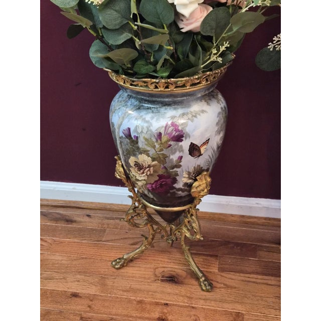 These large french floor urns are in excellent condition. They're unlike any other pair you'll find with gorgeous gilted...