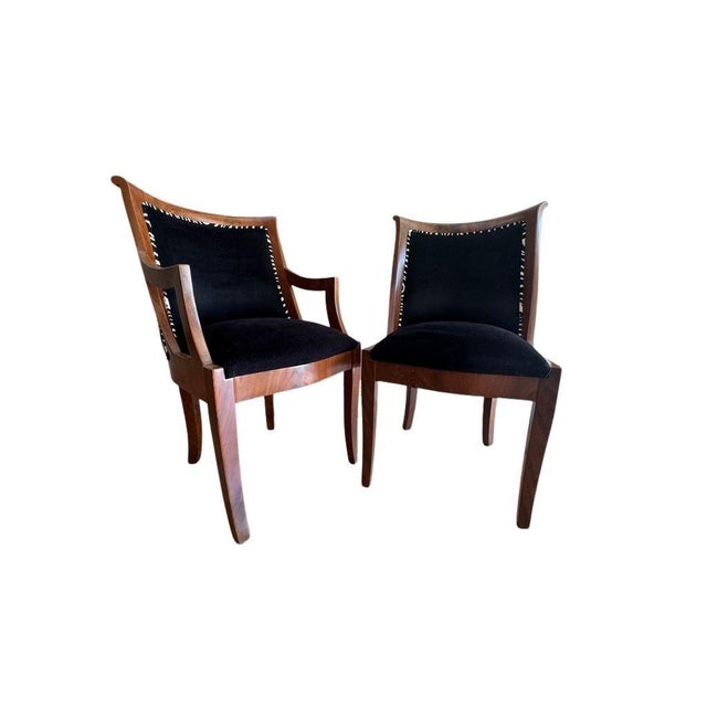 Striking pair of vintage Empire style side chairs featuring bold zebra upholstery and classic sculptural lines. Elegant...