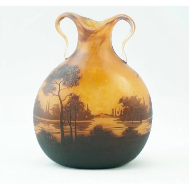 A sumptuous art nouveau French cameo lake landscape acid etched cameo vase with applied handles. Sunrise or sunset with a...