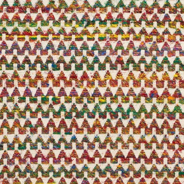 A chunky weave of twisted, recycled, multi-colored yarns, Idora is a wonderfully exotic accent fabric. Sold as a 2-yard...