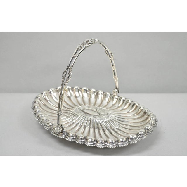 Antique Rogers & Bro Silver Plated Scalloped Wedding Brides Basket w Reticulated Handle. Circa Early 20th Century....