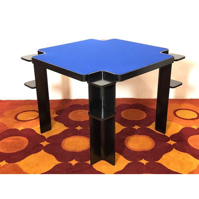 Cini & nilis 70s game table, the table structure is in steam-bent ash wood, the wooden top with blue sky cloth covering....