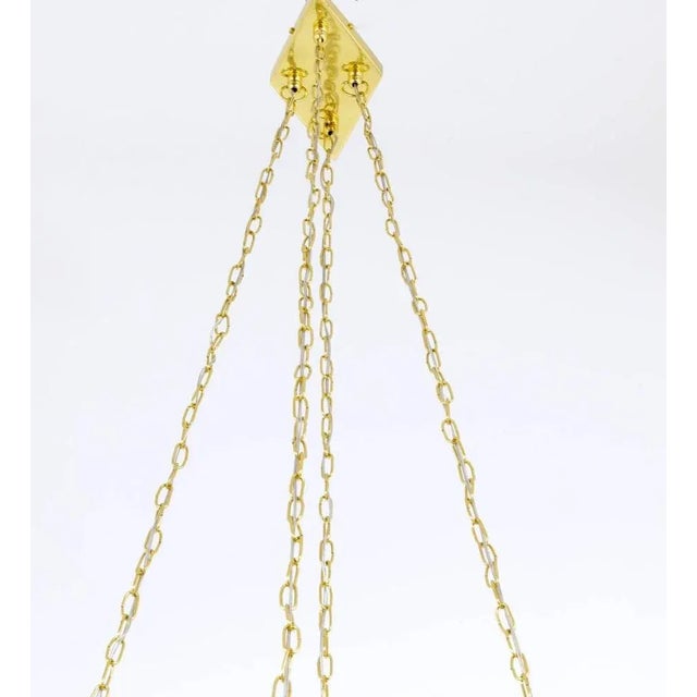 A beautiful and huge rhombic Austrian brass chandelier, designed and executed by Rupert Nikoll, Vienna in the 1950s. Has...