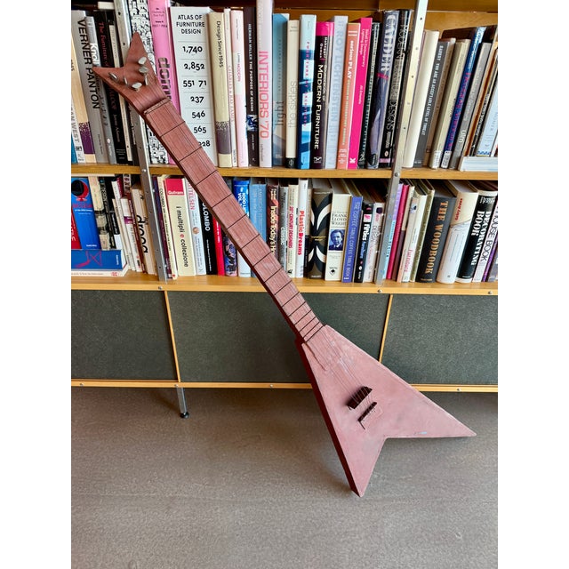 Imposing 56.5-inch sculpture is a masterfully crafted, solid steel homage to the legendary silhouette of the Flying V...