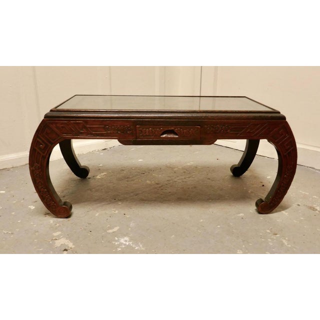 Oriental deeply carved low table, coffee table This is a very attractive piece, the table is in the style of an opium...