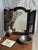 Dark brown wooden mirror with double rods. Height: 54.5 cm; Width when closed: 2.5 cm; Length when closed: 40 cm; Width...