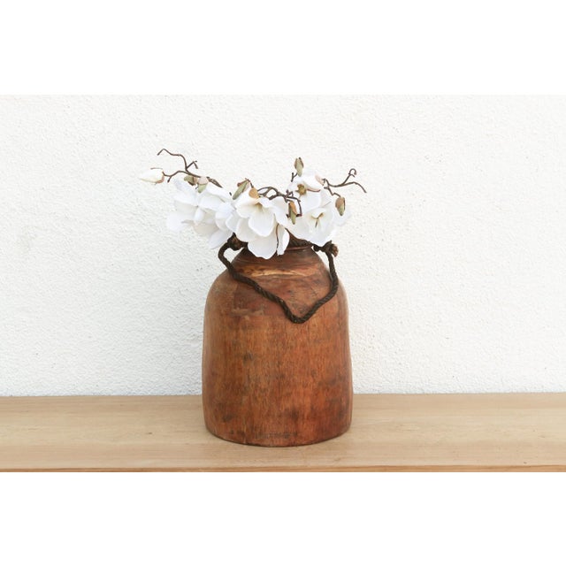 Originally used in village homes for storing milk, ghee, or grains, this antique wooden pot has survived generations of...