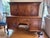 An elegant early 20th-century French walnut buffet à deux corps, featuring beautifully quarter-matched walnut veneered...