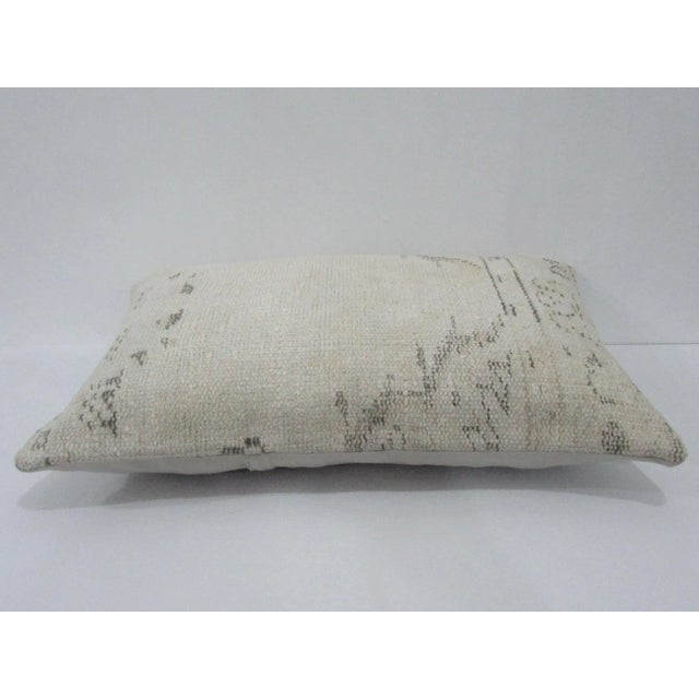 Decorative pillow cover made from a vintage Turkish handknotted rug. Backed with good quality cotton fabric. Pillow...