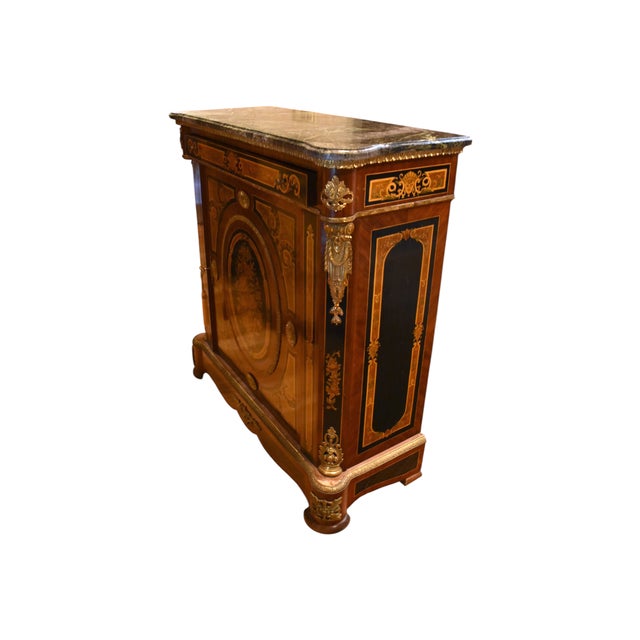 A marvelous boulle cabinet with detailed floral marquetry and mounted gilt metal accents, in the lavish style of Napoleon...