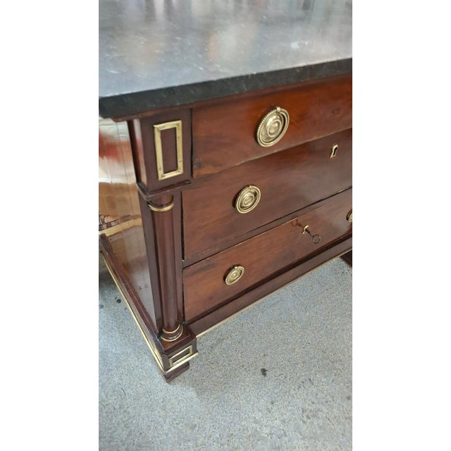 A very beautiful, small Empire-style chest of drawers. This chest has a marble top and rests on three drawers. It has been...