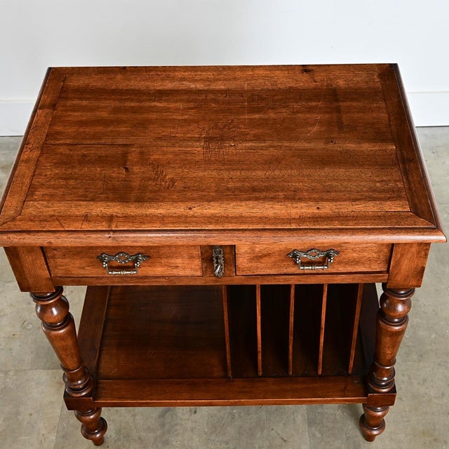 An ingenious side table from England, early to mid 20th century, this “Canterbury” type side table is an attractive...