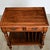 An ingenious side table from England, early to mid 20th century, this “Canterbury” type side table is an attractive...