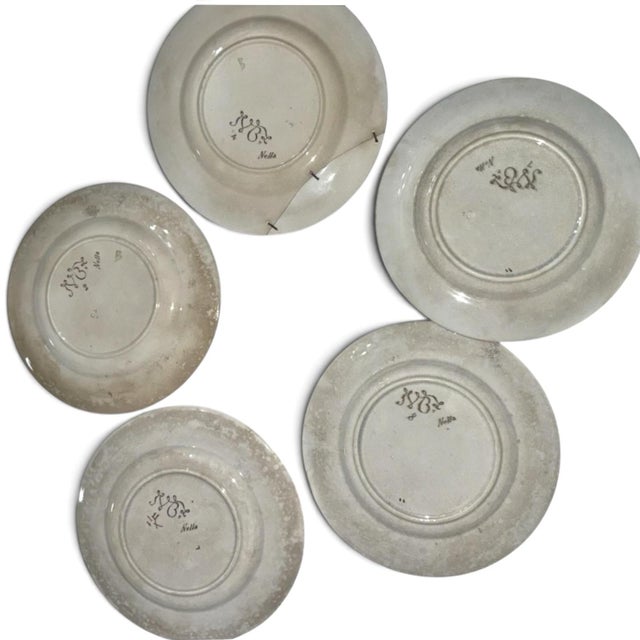 A stunning, highly collectible set of five (5) fine French faience earthenware dinner plates in the rare "Nella" pattern...