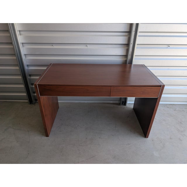 A beautifully refined Mid-Century Modern walnut writing desk by Glenn of California, dating to the 1960s. This example...