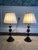 A pair of brass and wooden stacked ball table lamps with silk empire gather pleated lamps shades from the Oriental Lamp...