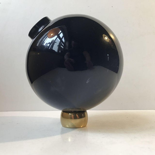 A rocking globe-shaped cobalt blue glass vase designed by Birgitta Watz in 1995 and manufactured by Lindshammar in Sweden....
