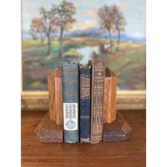 This pair of vintage handcrafted likely solid oak bookends exemplifies-the American studio craft movement of the late 20th...