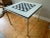 Post Modern Chrome and Formica game or card table. Features solid and heavy chrome frame and legs. Black and white formica...