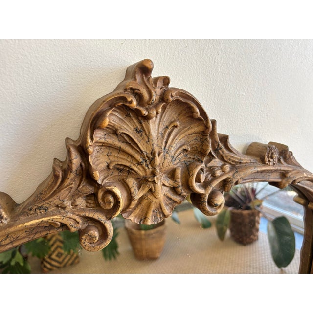 Large early 20th century art nouveau mirror, with finely carved details surrounding the mirror. Subtle gilt finish. Please...