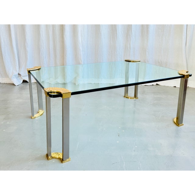 Stunning mid century clear glass coffee table with brass legs attributed to Peter Ghyczy, Germany, 1970s. Archetypal piece...