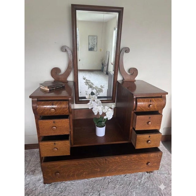 An absolute triumph of early 20th-century American cabinetmaking, this investment-grade drop-center wishbone vanity...