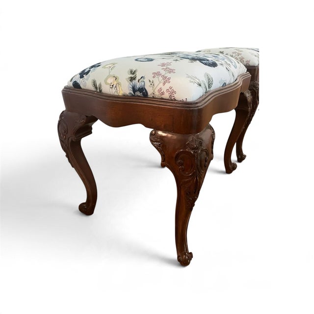 Elevate your interiors with this exceptional pair of vintage Louis XV style stools, newly and meticulously upholstered in...