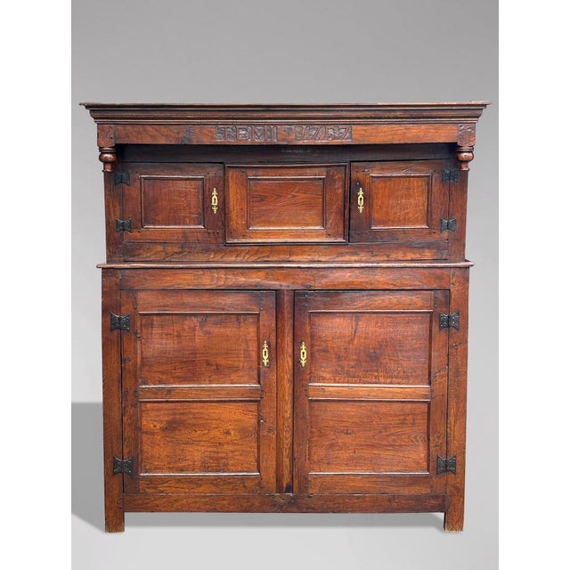 This charming mid-18th century English elm court cupboard, dating back to around 1757, is a remarkable piece that combines...