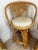 A set of Three Vintage Coastal Style Wicker Rattan Swivel Bar Stools. circa 1980s Feature a Rattan frame, cane detailing...