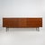 An Italian sideboard from the 1960s, characterised by elongated proportions and an essential design reflecting the...