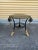 Beautiful and unique Hollywood regency style black and gold wrought iron side table. Has great painted gold details on the...