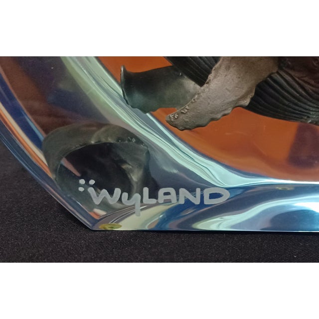 A rare and striking limited-edition Robert Wyland "Humpback Whale Planet" lucite sculpture, numbered 64 out of 750....