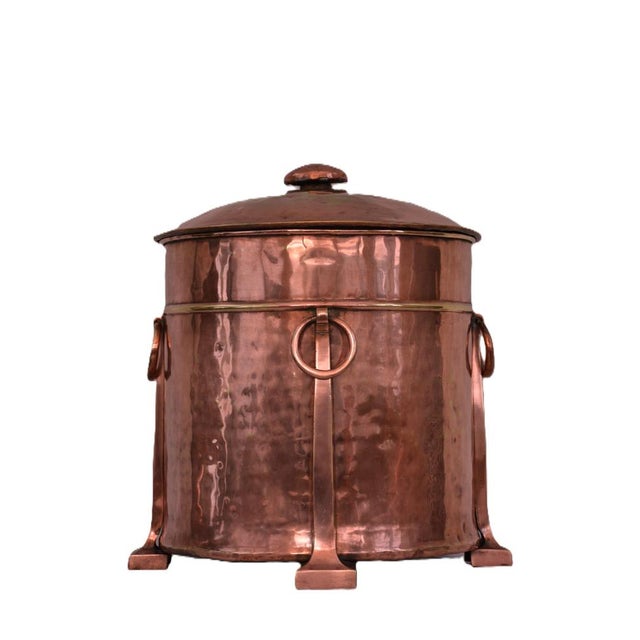 Stylish and elegant Arts and Crafts copper plated metal log bucket of circular form, having lift up lid with a substantial...