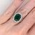 This beautiful ring features a 5.6 carat cushion cut Emerald gemstone with natural earth mined diamonds set in solid 14K...