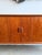 A Danish modern credenza designed by Svend Aage Larsen and produced by Faarup Møbelfabrik in Denmark, circa 1960s....