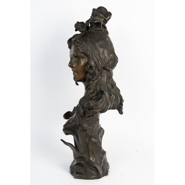 Patinated bronze sculpture depicting the bust of a young woman, Art Nouveau, circa 1900. Important Art Nouveau-era...