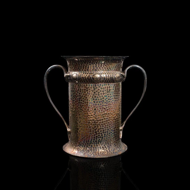 This is an antique twin handled tankard. An English, silver plated jug or display vase with Art Nouveau taste, dating to...