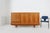 A refined French mid‑century sideboard crafted in cherrywood, circa 1950, showcasing the elegant simplicity and functional...