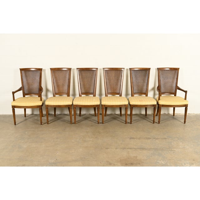 A gorgeous set of six French Regency Louis XVI style dining chairs By Henredon USA, Circa 1970s Carved solid walnut...