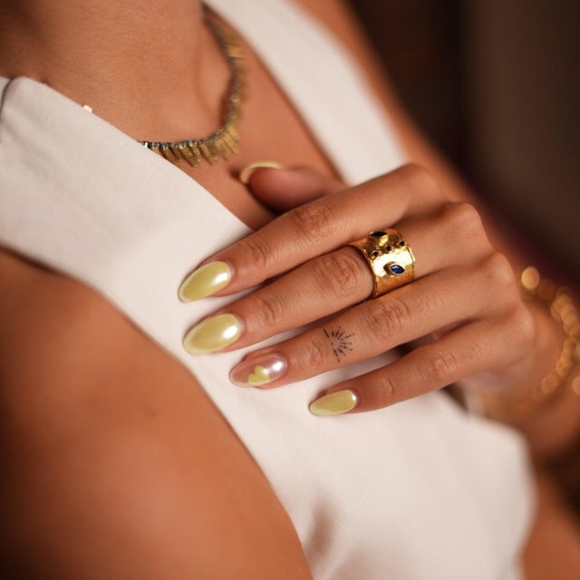 Mystic Sapphire & Gold Chunky Cuff Ring , designed to captivate with its bold and mystical elegance. This stunning piece...