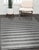 Yara Alluring Gray Handmade Wool Rug, Country of Origin: India. This exceptional piece presents a striking, contemporary...