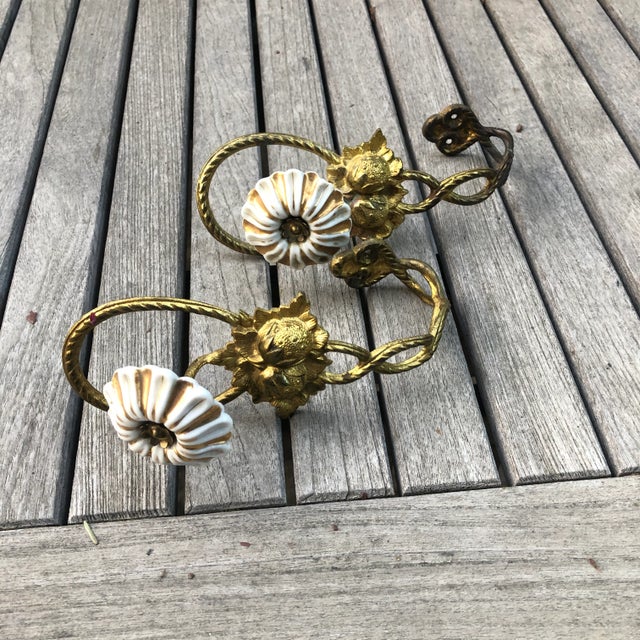 Art nouveau Gold toned brass strawberries and floral draperies tie backs. The gold and white porcelain flowers Very good...