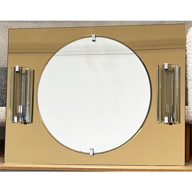 This exquisite Veca vanity mirror is a true statement piece, perfect for adding luxury to your powder room or entryway....