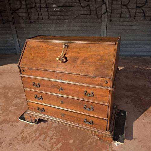 Antique walnut writing desk featuring rocaille bronze accents and an internal compartment.