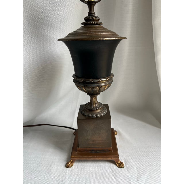 Vintage Mid 20th Century Neoclassical or Hollywood Regency Style black urn on footed pedestal brass and bronze lamp with...